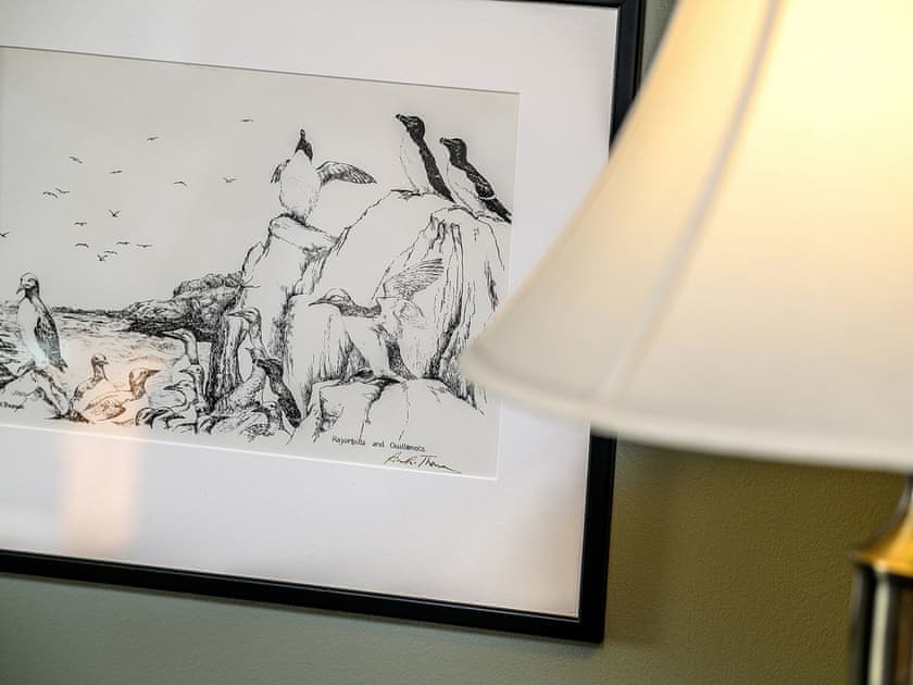 Seabird artwork and lamp in the living room